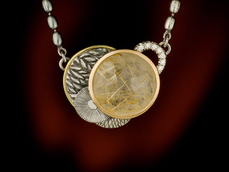 rutilated quartz and diamonds pendant in silver and gold
